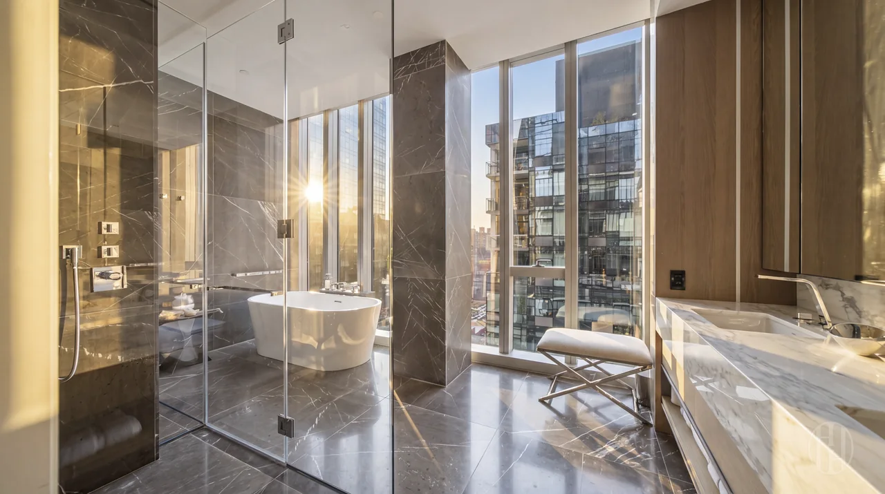 Primary bathroom with shower and soaking tub at 515 West 29th Street, Residence 9